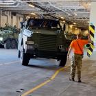A new NZ Defence Force Bushmaster armoured vehicle being driven on to the HMNZS Canterbury in...