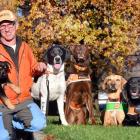 LandSAR dog handler Barry Dougherty relaxes in Dunedin with his family of dogs (from left) 19...