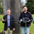 Prof Richard Green, left, and Dr Sam Schofield with the new chainsaw drone they’ve developed as...