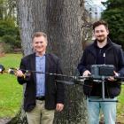 Prof Richard Green, left, and Dr Sam Schofield with the new chainsaw drone they’ve developed as...
