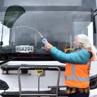 Queenstown-based Otago regional councillor Alexa Forbes christens a new electric bus with a...