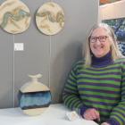 Alexandra-based ceramicist Ruth Arnott poses with some of her work on display and sale at the...