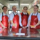 Selling cheese rolls as part of their school project and for The Cancer Foundation are St Peter’s...
