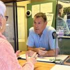 Senior Constable Paul Hampton, pictured here at the front desk, gave Maggie his card which meant...