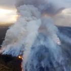 Multiple fire crews and appliances from as far as Glenorchy and six helicopters with monsoon...