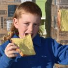 Fred Sutton, 9, cannot wait to show which side his bread is buttered on in Kaitangata yesterday....