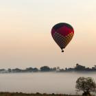 A hot air balloon in the air in Brazil. Stock photo: Getty
