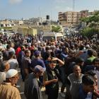 Relatives mourn as the lifeless bodies of Palestinians are being brought to the Nasser Hospital...