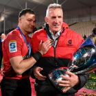 David Havili of the Crusaders and head coach Rob Penney celebrate after winning the Super Rugby...