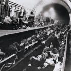 Weary Londoners sleep in the comparative safety of a tube station, taken out of service and...