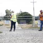 WorkSafe New Zealand officials examine the the gate through which Lachie Jones is thought to have...