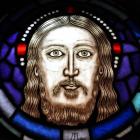 Jesus Christ has central place at the top of the tracery.