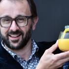 Dunedin oncologist Prof Chris Jackson pours a glass of orange juice, referencing a vitamin C ...