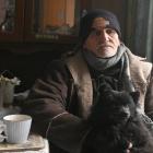 South Dunedin resident Kevin Kehoe, holding his dog Shady, is planning to sell his flood-damaged...