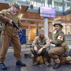 Lee George Russell guards a captive, Hamish Norton, while Rolien Ham-Geliefde provides treatment...