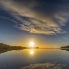 The sun rises over Papanui Inlet. Photo: Ian Griffin