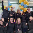 Plaza SuperValue Invercargill owners Jigs and Shelly Buha (back row, second and third from left)...