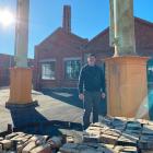 Dunedin Gasworks Museum Trust chairman Jonathan Cweorth stands in front of the now truncated and...