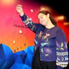 Events manager Rachel MacJeff holds a baby constellation mobile, one of many items people can...