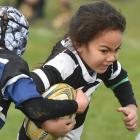Southern player Utalia Moataane, 6, charges on at the annual Taieri sevens junior rugby...