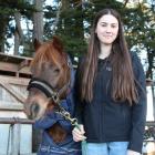 Harness racer Millie Bond with her pony George, or ‘‘Ginger Ninja’’, at her grandparents’ stables...
