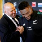 Assistant coach Jason Ryan congratulates Timoci Tavatavanawai at the All Blacks squad...
