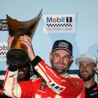 Shane Van Gisbergen celebrates in victory lane after winning the NASCAR Cup Series Grant Park 165...