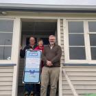 Community Trust of Mid and South Canterbury chairman Nathan Mills (right) presents Victoria Trust...
