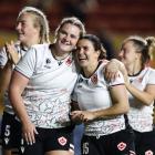 Canadian team members celebrate their win over the Black Ferns in the Women's World Cup semifinal...