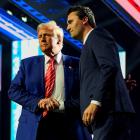 Donald Trump shakes hands with Turning Point USA founder Charlie Kirk in December 2024. PHOTO:...