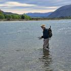 Oamaru fisherman Graeme Anderson spin fishes the Waitaki River near the Kurow Bridge on Opening...