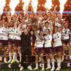 Adam Reynolds and Billy Walters of the Broncos hold aloft the Provan-Summons Trophy as the team...