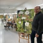 Admiring the work of Alexandra artist Jen Anderson in his Roxburgh gallery is Gordon Still, of...