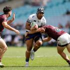 Tom Ale of the Warriors is tackled during the NRL State Championship Grand Final match between...