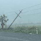 A power pole leans in the wind near Bluff. Photo: Gerrit Doppenberg