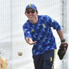 Otago coach Josh Tasman-Jones underarms the ball back to a player during a training session at...