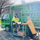 KiwiHarvest Invercargill food rescue driver Dwight Gray hands over a box of food to Murihiku...