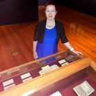 Prof Simone Celine Marshall inspects a collection of medieval books of hours at the Dunedin...