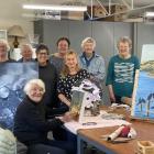 A group of local painters gathering with some of their works ahead of their "Art in November"...