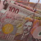 The cleaner opened the cushion and pulled out an old plastic bag full of $100 notes. Photo: Supplied