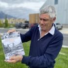 Former farmer and winegrower turned author John Cook with his updated version of The Gibbston...