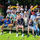Gathering with Broad Bay School pupils and teacher Daniel Ashton is cricket stalwart Hamish...