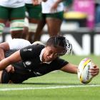 Black Ferns forward Liana Mikaele-Tu’u reaches for the line after being tackled by South African...