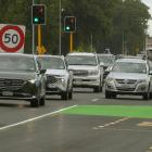 A vehicle cutting into the right lane on Halswell Rd after running into the start of a bus lane....