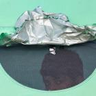 A displaced child looks on from a tent in Beirut, Lebanon. Photo: Reuters