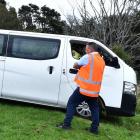 Emergency services use a winch to hoist a van up from over the edge of a steep bank near Unity...