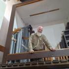 Ron Newton in the midst of reinstalling the pipe organ in the Hall of Memories at Waitaki Boys’...