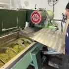 Press operator Steve Morris watches the malaxation stage of the pressing process, where crushed...