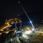A home prebuilt in Christchurch is craned on to a steep Queenstown section at nighttime recently....