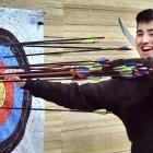 Otago University Archery Club president Charlie Boocock-Yee removes arrows from the club’s new...
